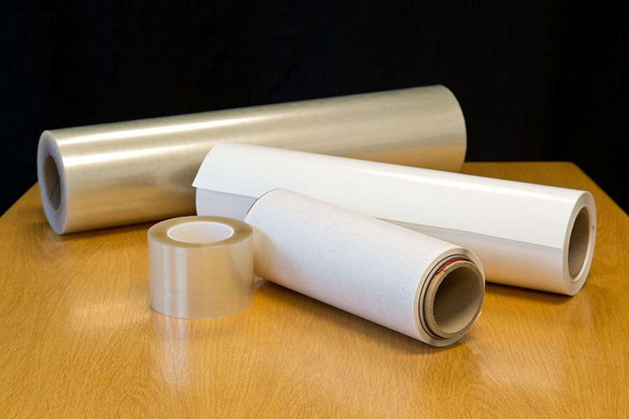 Rolls of tape and adhesives on a table